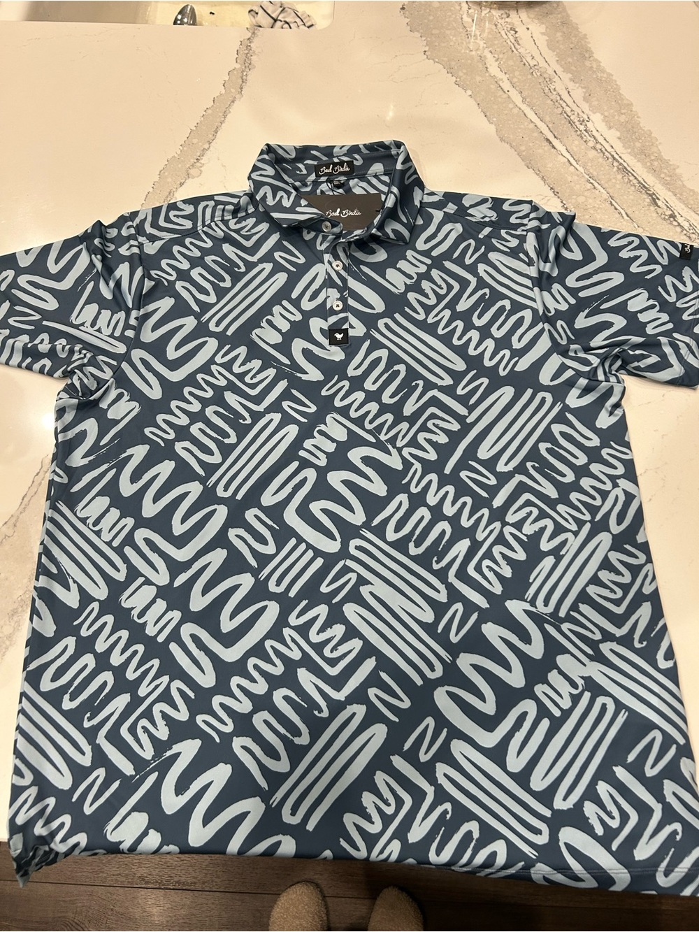 Bad Birdie Navy Polo with Light Blue Scribble Pattern